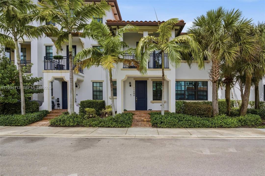 A modern, beautifully maintained townhome in the gated, nicely landscaped community of Raintree at Mayfair.