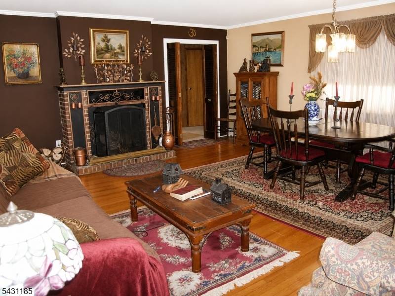 Nestled on a private wooded lot in desirable Watchung, this inviting 3 bedroom ranch offers the perfect blend of comfort, charm, and outdoor living.