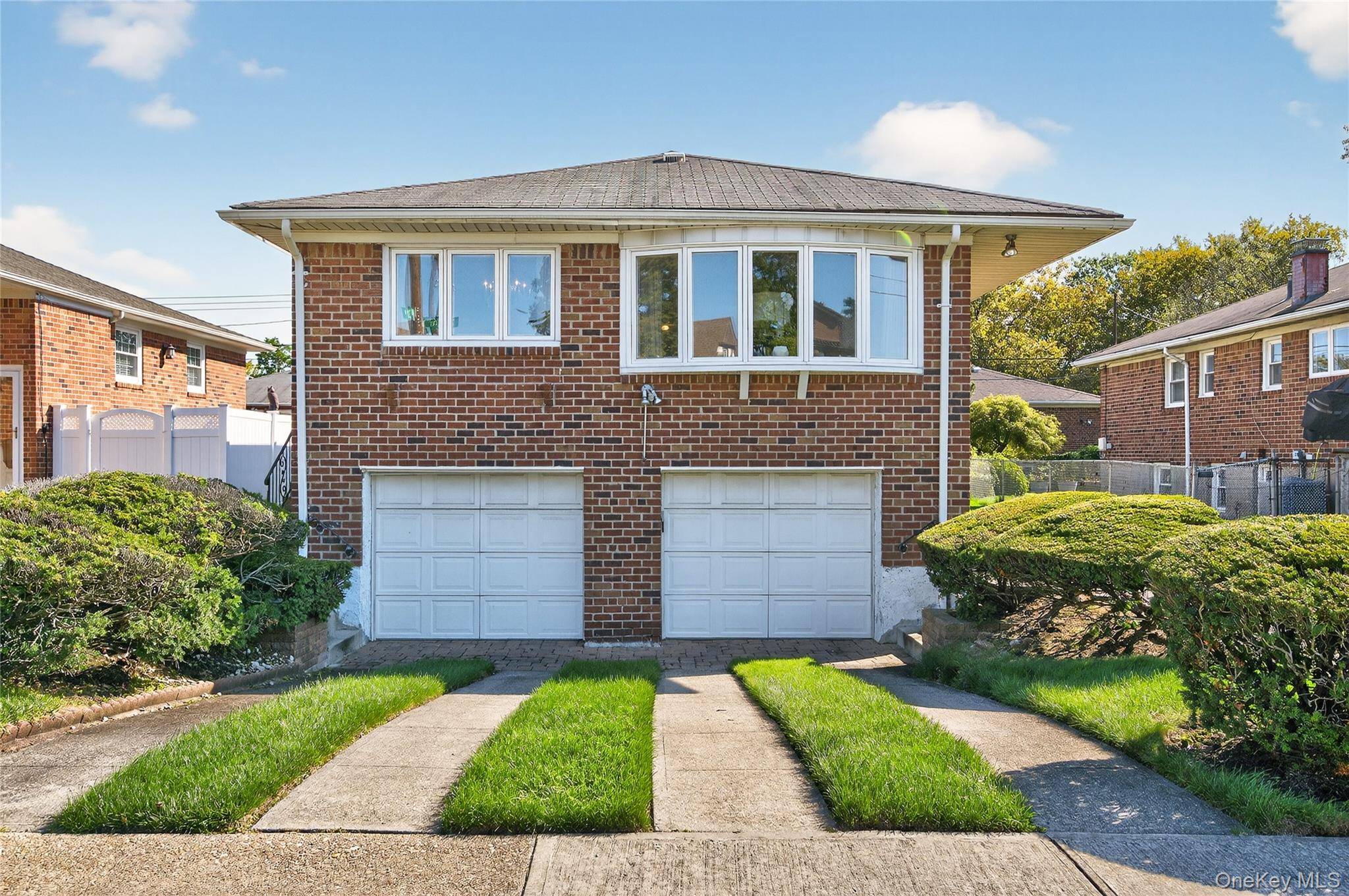 Step into this spacious Four Bedroom, Two and a Half bath High Ranch home in the heart of Bayside.