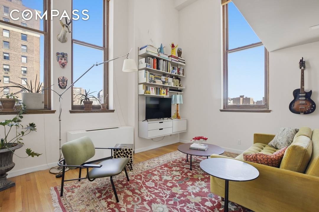 Lined with massive windows, this dramatic corner two bedroom, two bath duplex offers soaring ceilings and an incredible abundance of natural light.