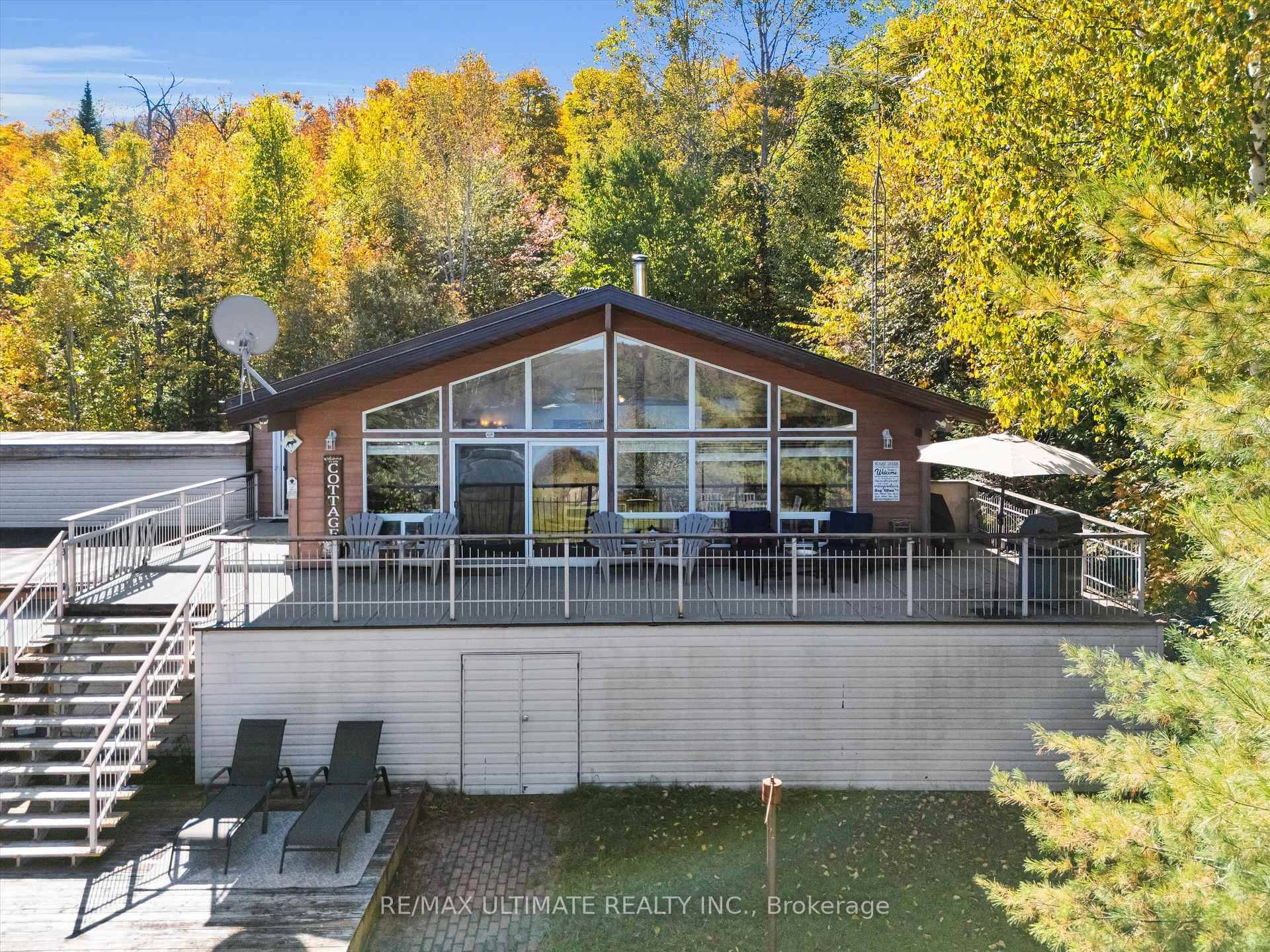 Foote Lake Cottage in Novar, offers a generous 105 by192 foot lakefront lot, Featuring 3 2 bedrooms, 2 full bathrooms, with two garages to store a boat or can be ...