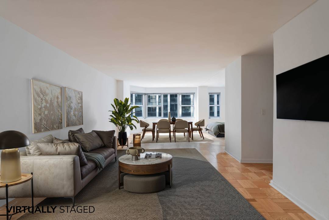 Situated on the southeast corner of 77 West 55th Street, we welcome you to this spacious and sunny alcove studio in a full service luxury condominium located in the heart ...