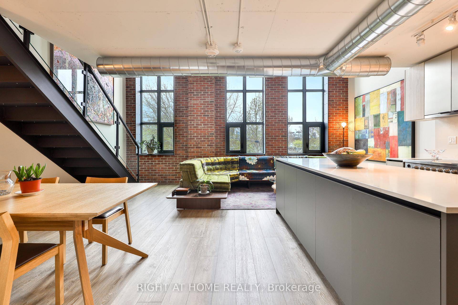 This celebrated 2 storey residence, prominently showcased in Wonder Lofts' marketing, is a rare offering of nearly 1, 500 square feet of dramatic living space.