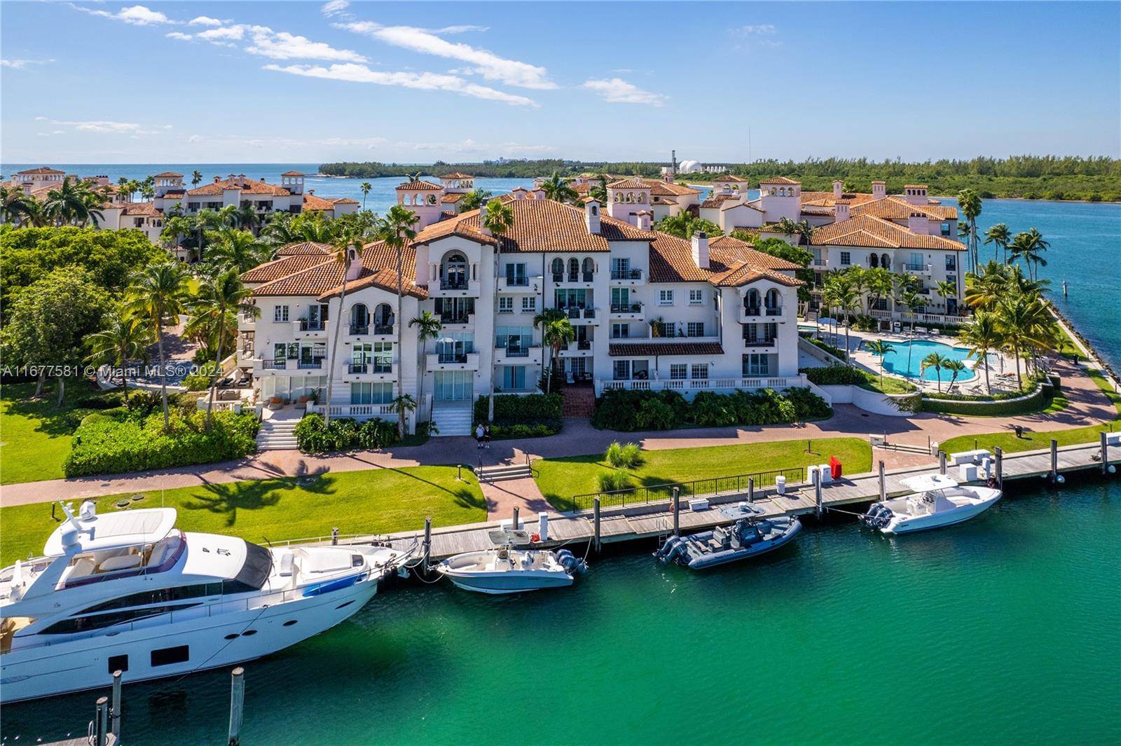 Live the Fisher Island lifestyle in this beautiful Bayside Village condo on Fisher Island overlooking the Fisher Island marina, golf, and Miami Beach skyline.