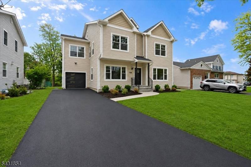 Stunning completely rebuilt and expanded luxury residence in highly sought after Scotch Plains offering the look and feel of true new construction.