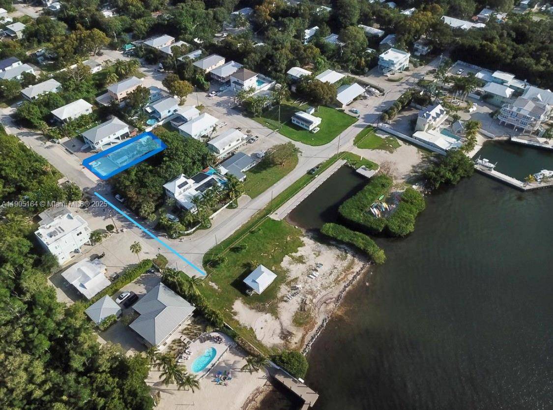 Beautifully remodeled CBS coastal cottage tucked into the highly desirable Riviera Village in Key Largo.
