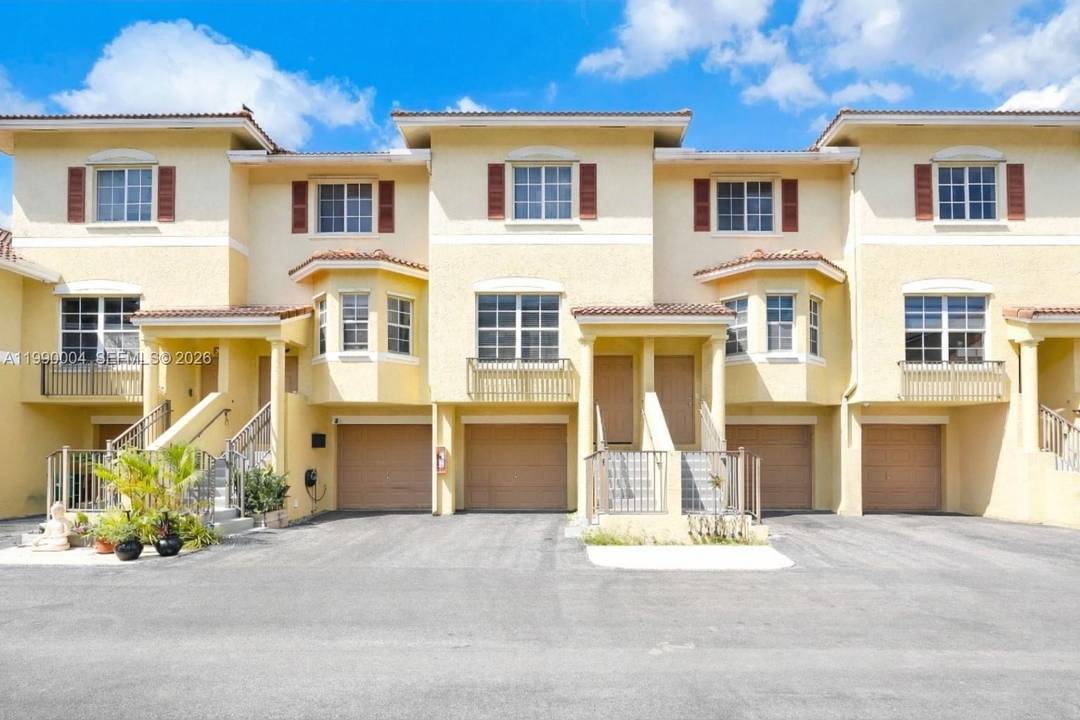 Beautifully remodeled trilevel townhouse with stunning wood flooring throughout and custom built closets.