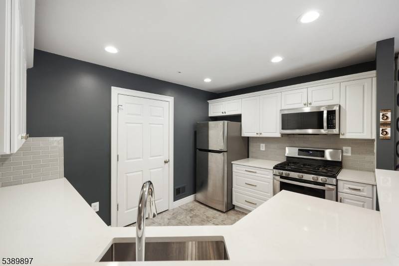 Welcome to this beautifully updated Spring Ridge end unit condo, where style meets functionality.