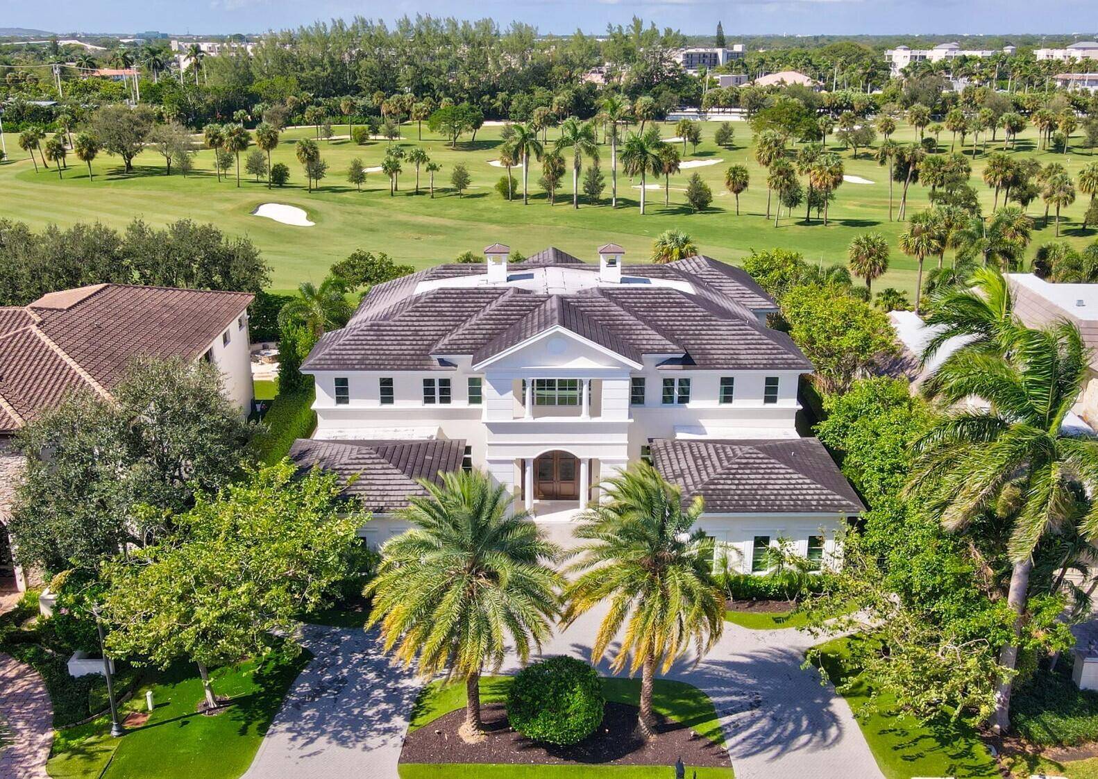 This exceptional Golf Course residence offers elegance and modern contemporary luxury Style in The Prestigious Royal Palm Yacht CC.