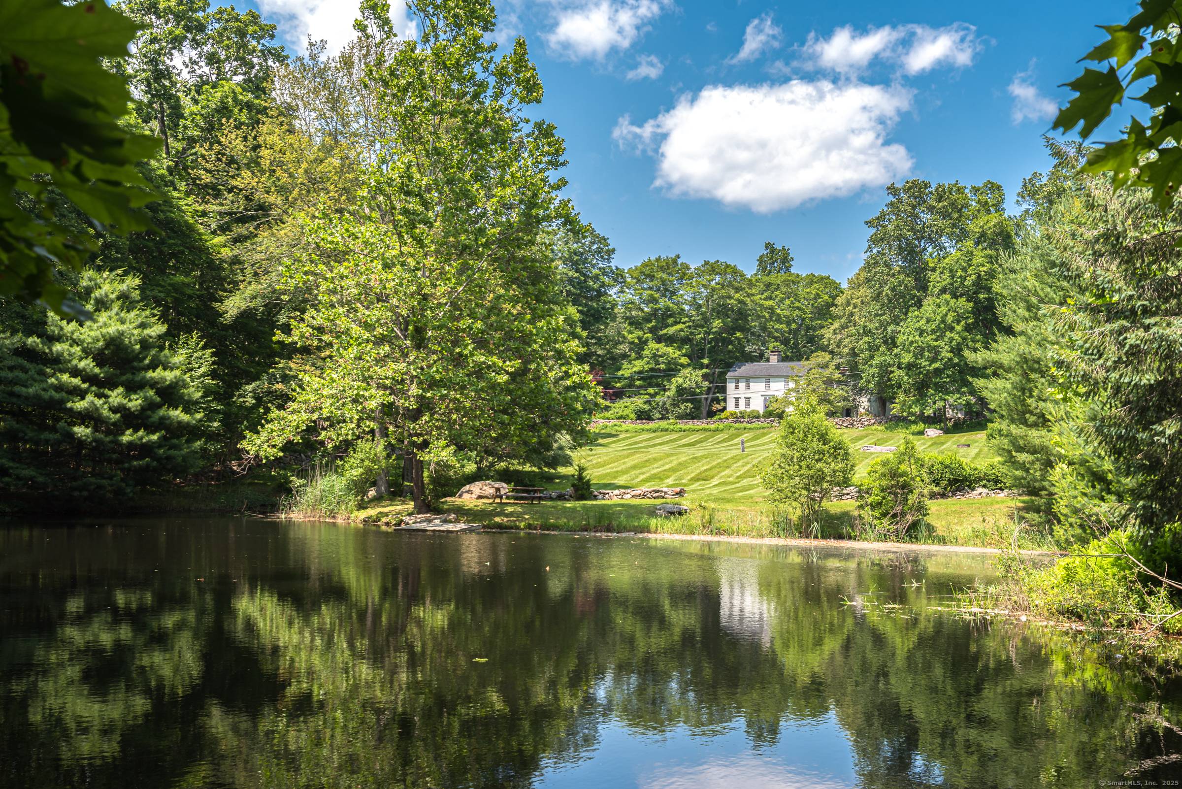 Welcome to 85 Potash Hill in Sprague, CT a rare and remarkable property offering two unique homes nestled on 2 parcels equalling 32 total pristine park like acres.