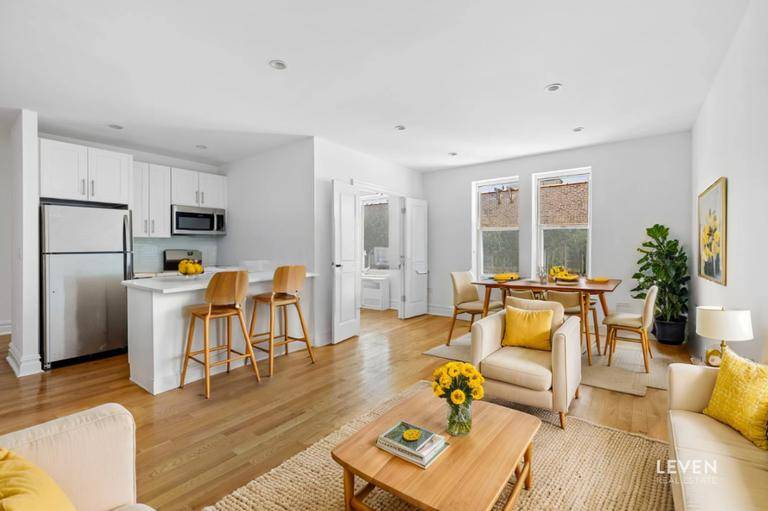 Investor friendly ! This beautifully renovated top floor unit offers low monthly carrying costs, flexible purchase options, and a bonus room ideal for a home office or guest room.