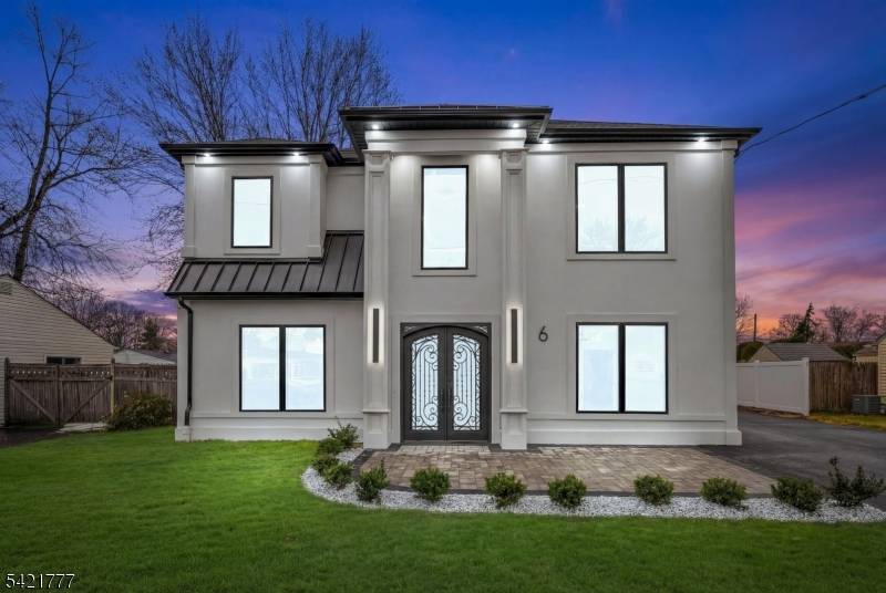 Welcome to 6 E Knollwood Road, a beautifully crafted custom luxury home that blends timeless elegance with modern comfort.