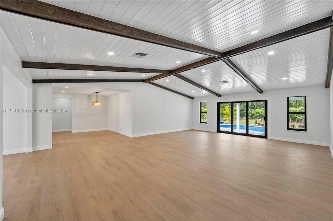 Welcome to this fully renovated oasis in the heart of Jupiter Farms !