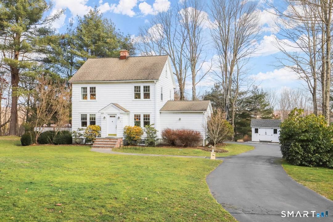 Sunny Colonial in convenient south Newtown location on level landscaped 1.