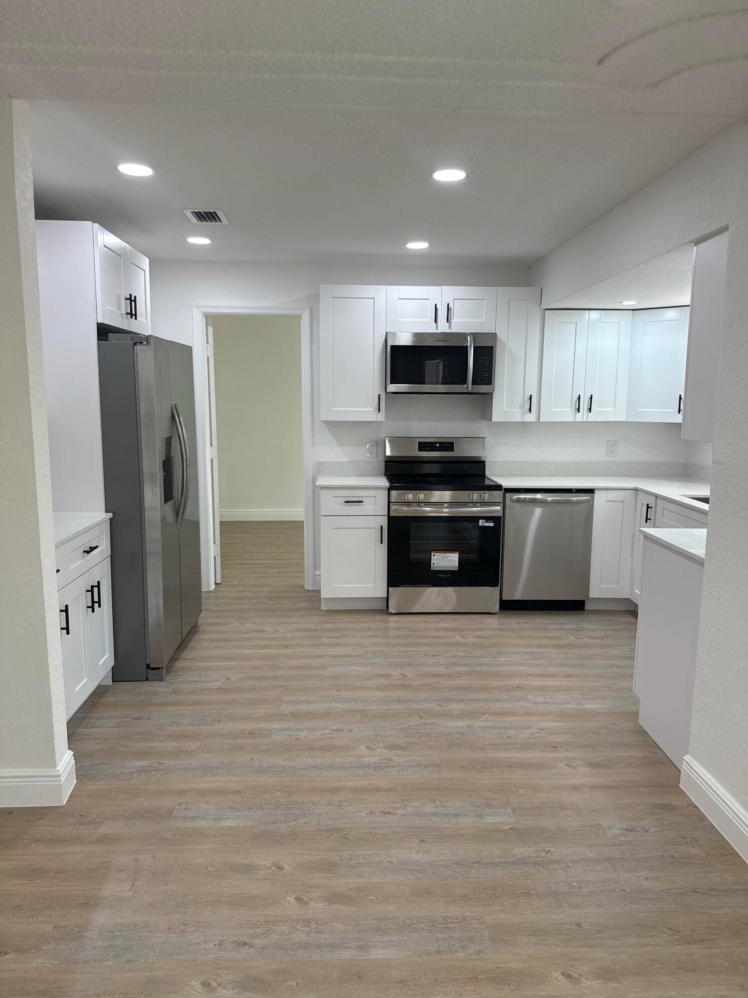 Completely renovated 4 bedroom, 2 bath with glass doors home featuring 2 spacious living areas and 1, 736 sq ft of modern living space.