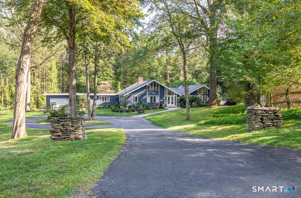 Stunning custom contemporary ranch tucked at the end of a quiet cul de sac !