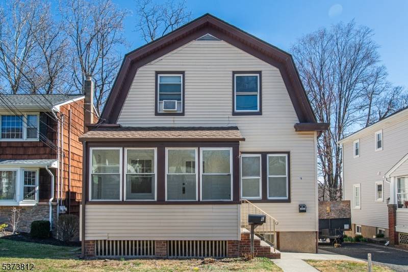 Beautifully renovated 2 family home located on a quiet block.