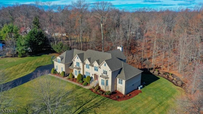 This exceptional custom built home is nestled on a beautifully landscaped 1.