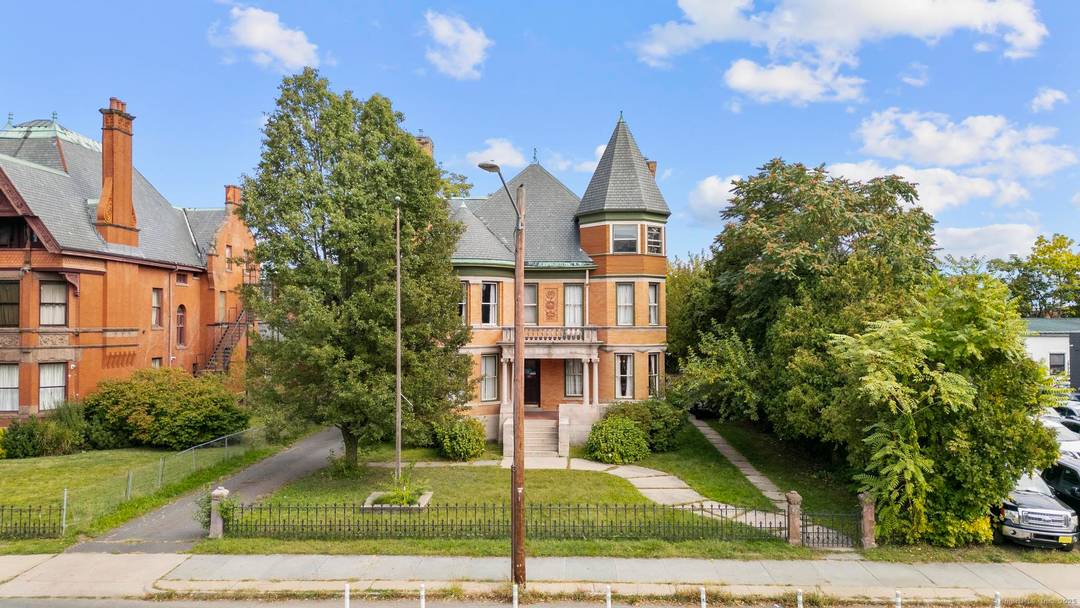 Welcome to 14 Wethersfield Avenue, an impressive mixed use 7, 188 SF brick Victorian set on a.