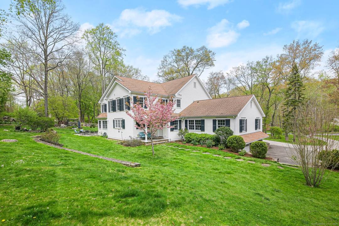 Tucked at the end of a quiet cul de sac in one of New Canaan's most sought after neighborhoods, this exceptional six bedroom Colonial offers the rare combination of privacy, ...