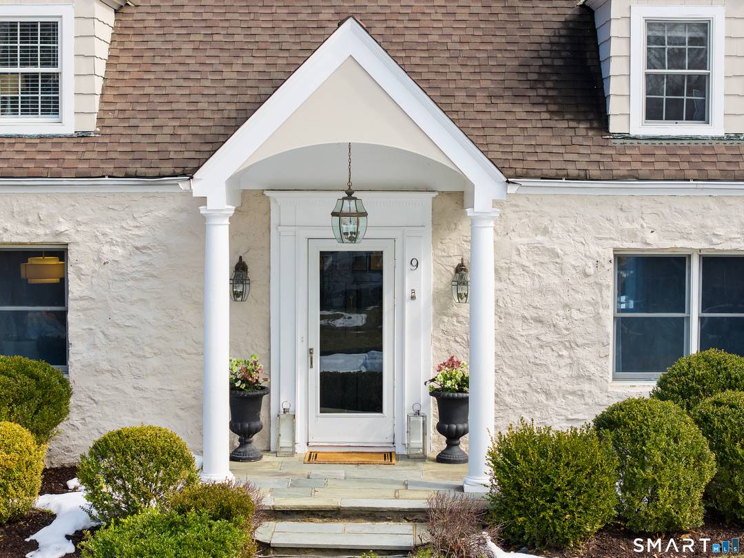 Located on a quiet cul de sac in Darien's sought after Ox Ridge School district, this inviting 4 bedroom home offers timeless character, privacy, and versatile living.