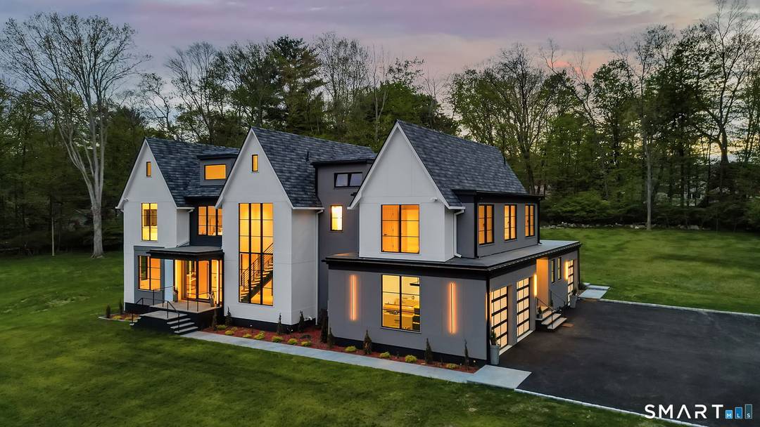 Discover exceptional modern living in this stunning new construction home set on 1.