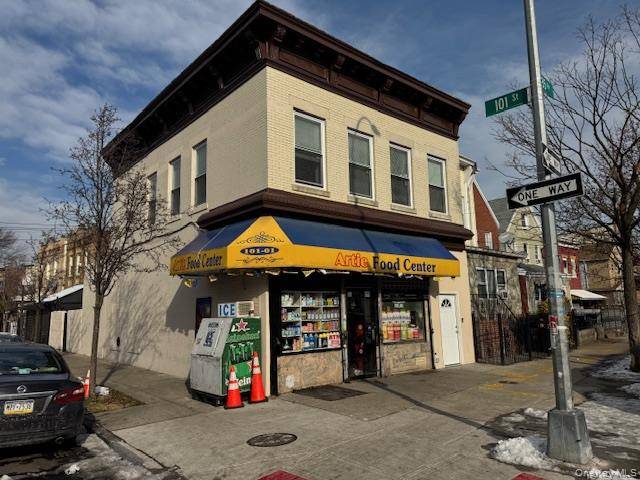 Prime corner retail property featuring a ground floor store plus a fully renovated 3 bedroom, 1 bath residential apartment above.