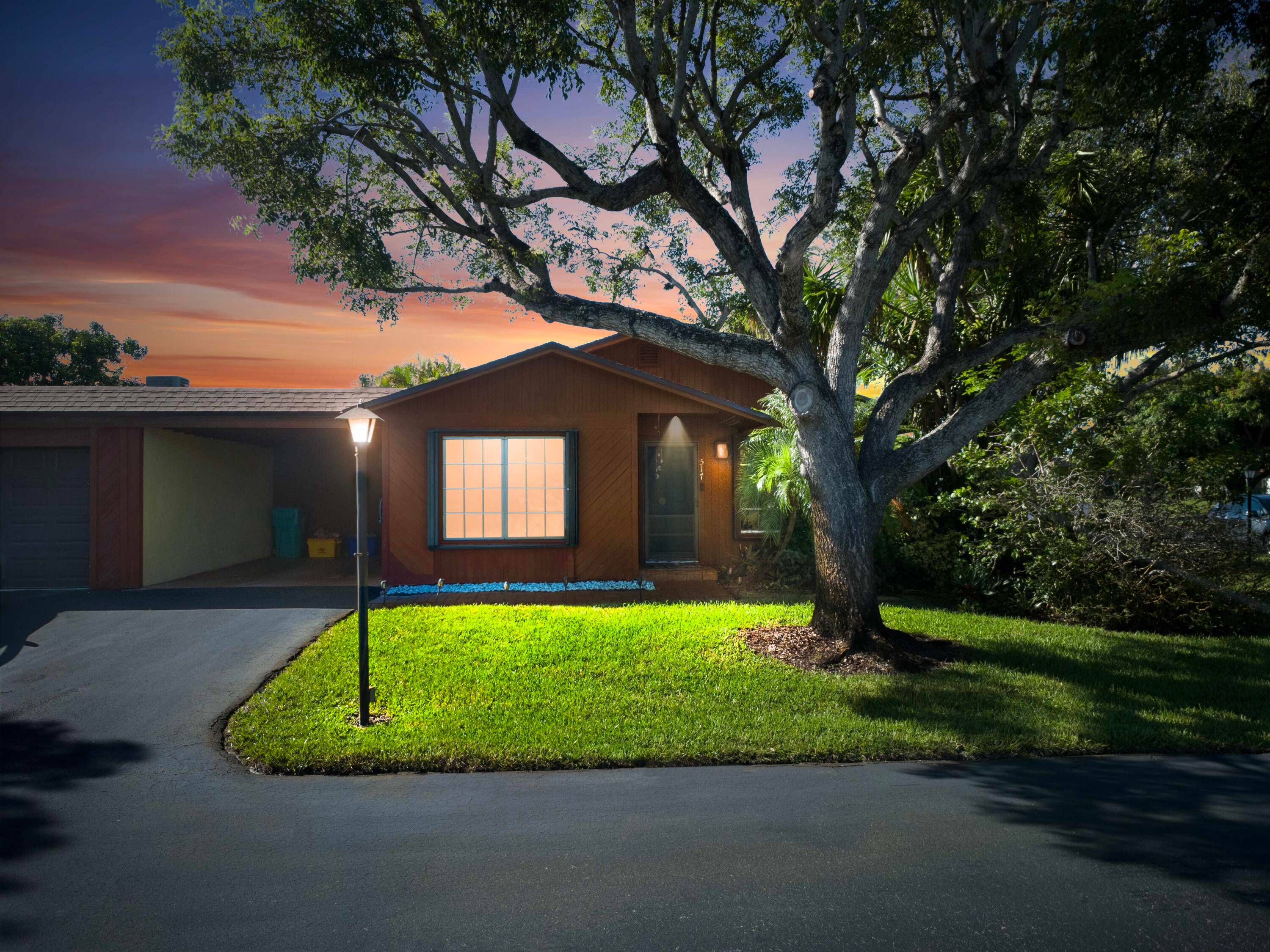 Rarely Available, Minutes from the Ocean, This Well Maintained 2 Bedroom 2 Bath Corner Unit Villa with Carport offers a Perfect Blend of Comfort, Privacy, and Convenience.