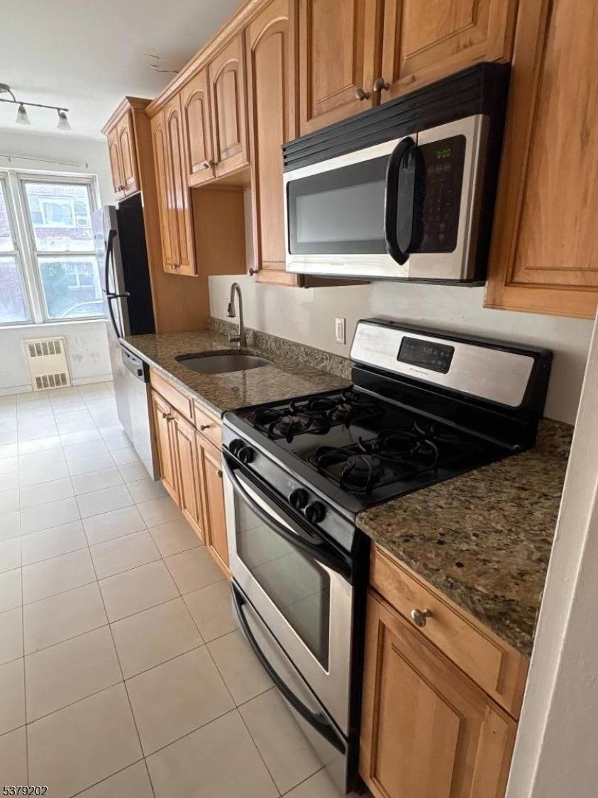 OVERSIZED 904 sq ft, first floor, south facing, end unit condo with plenty of closet space in the heart of Jersey City's desirable McGinley Square.