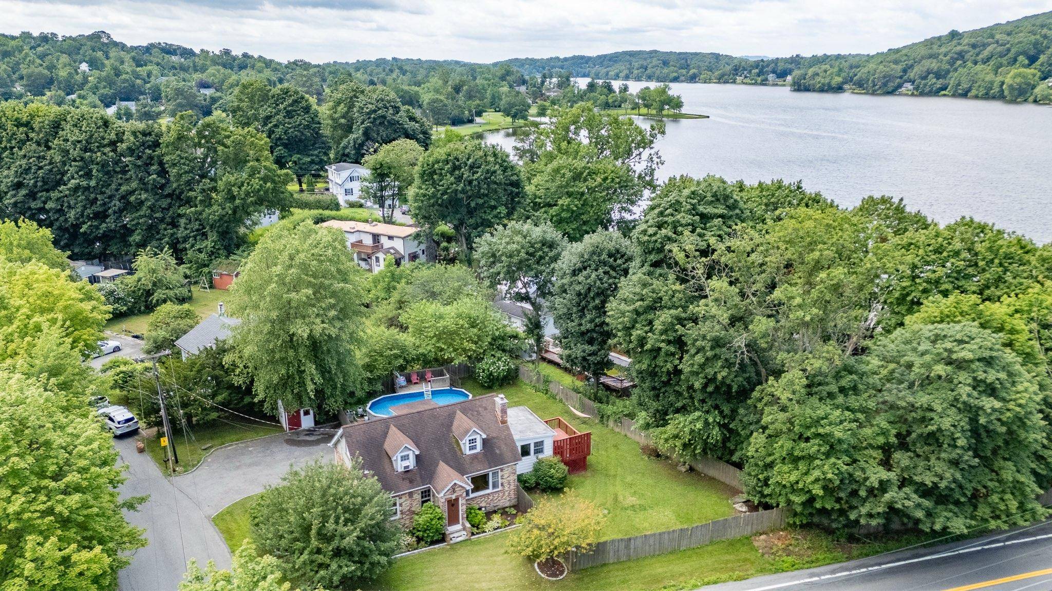 Charming 3 Bedroom Home on a Corner Lot with Lake Access Discover this inviting 3 bedroom, 2 full bath home situated on a spacious corner lot.