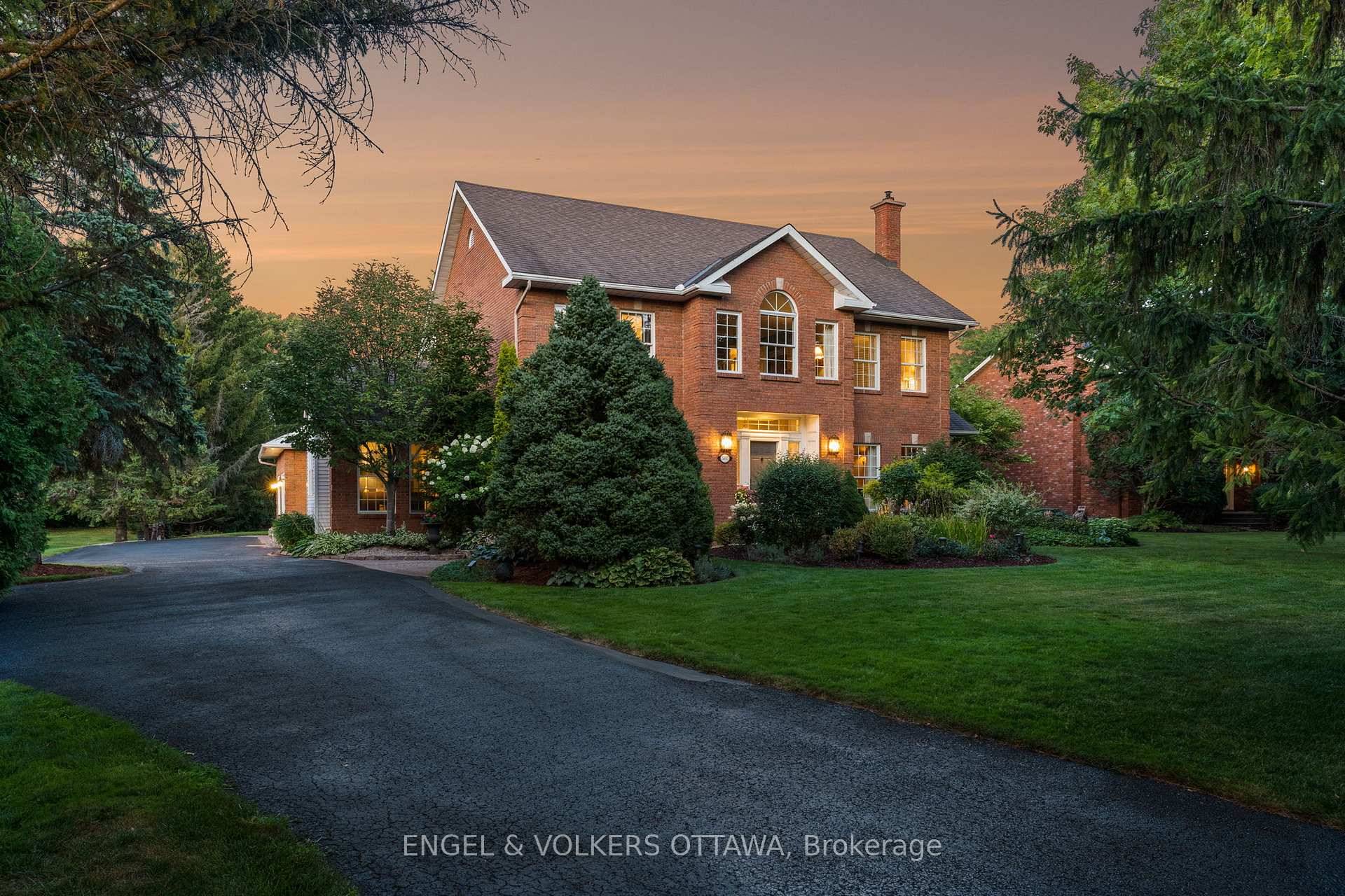 Poised on a serene ravine lot within the prestigious enclave of Manotick Estates, this beautiful Georgian inspired all brick residence embodies distinguished architectural character and timeless elegance.