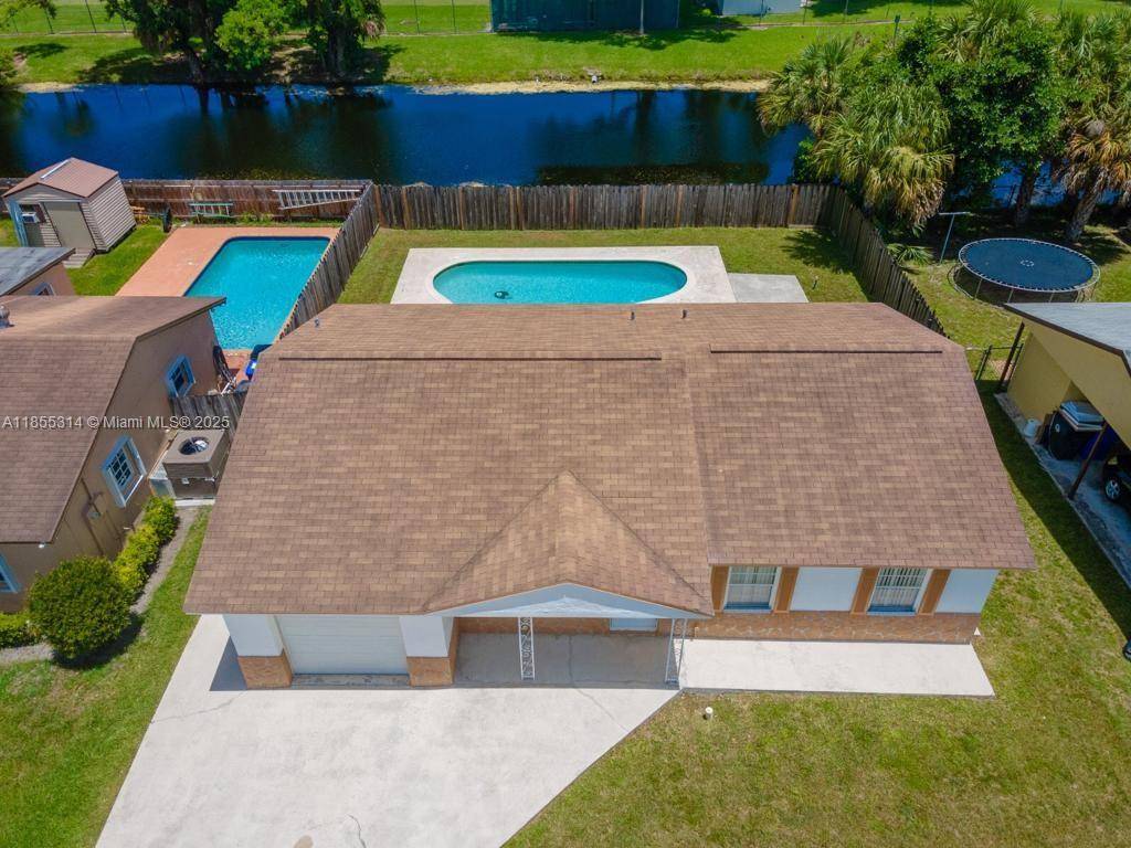 Beautifully updated 3 2 home with 1 car garage on an oversized canal front lot with no rear neighbors.