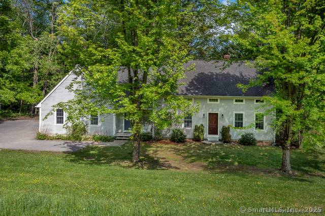 Nestled along the coveted west shore of Woodridge Lake, 455 Milton Road reveals a rare sanctuary of lakefront elegance.