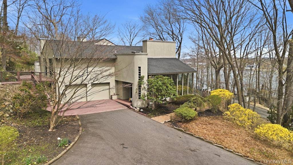 This exceptional 4 bedroom residence blends architectural drama with timeless warmth.