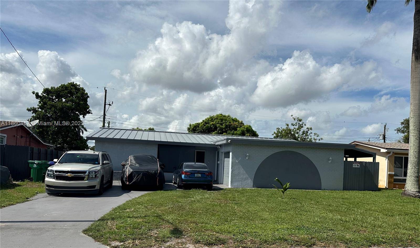 Updated 4BR 3BA home with pool, impact windows amp ; doors, and metal roof.