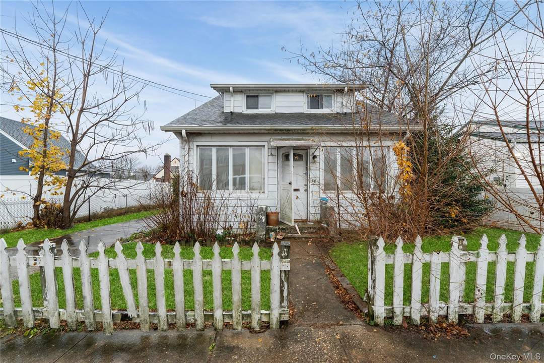 Three bedroom bungalow with unfinished basement, large back yard, approximately 20 year old roof, needs work.