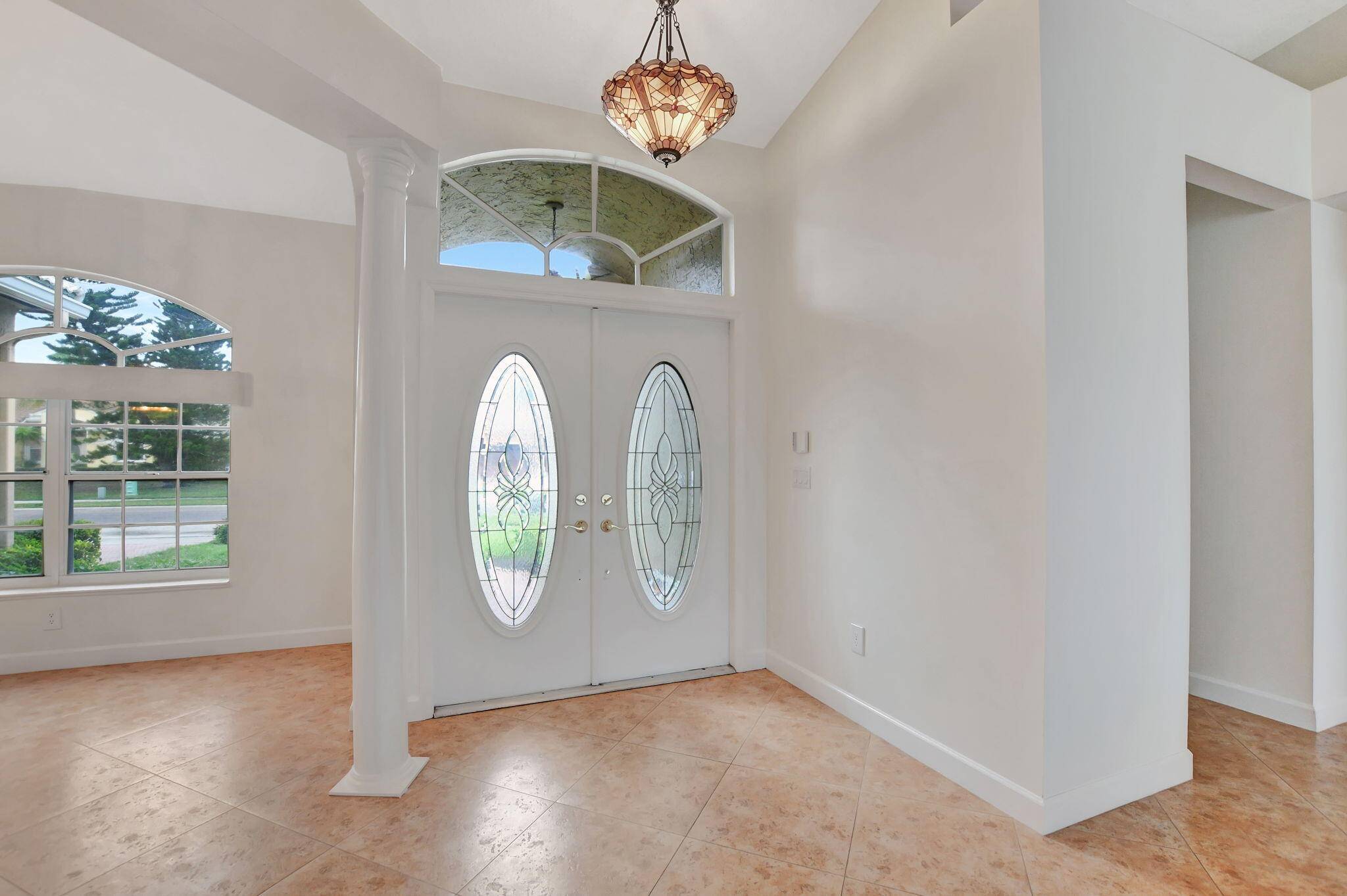 Gorgeous 4 bedroom, 2 bath one story home w screened in pool, lake view on a cul de sac street !