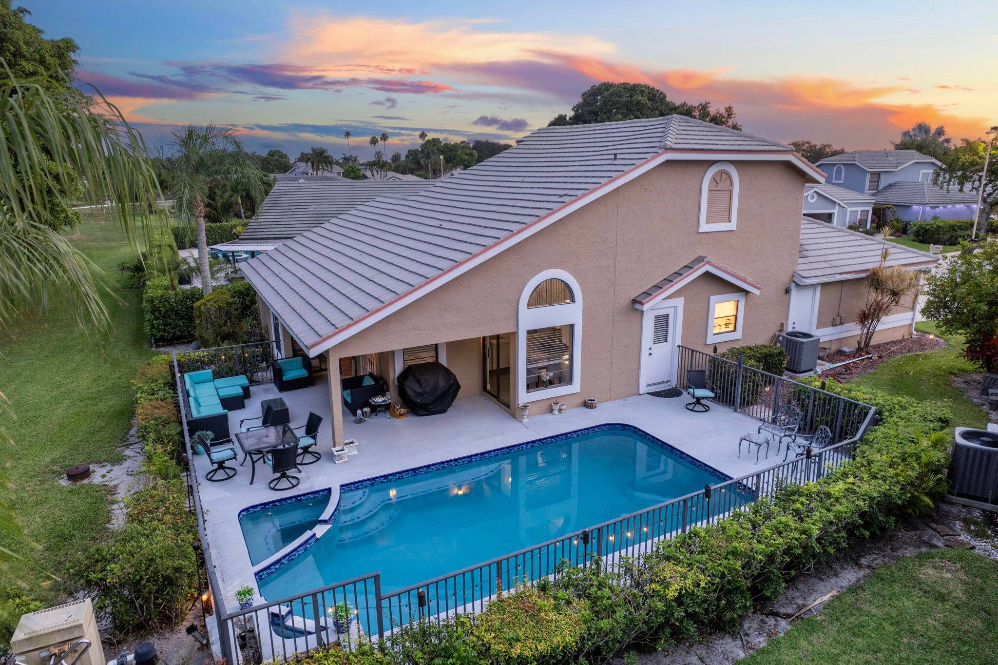 Welcome to your dream home on the 5th hole of a beautifully maintained golf course, nestled in a quiet cul de sac in one of South Florida's premier gated communities ...