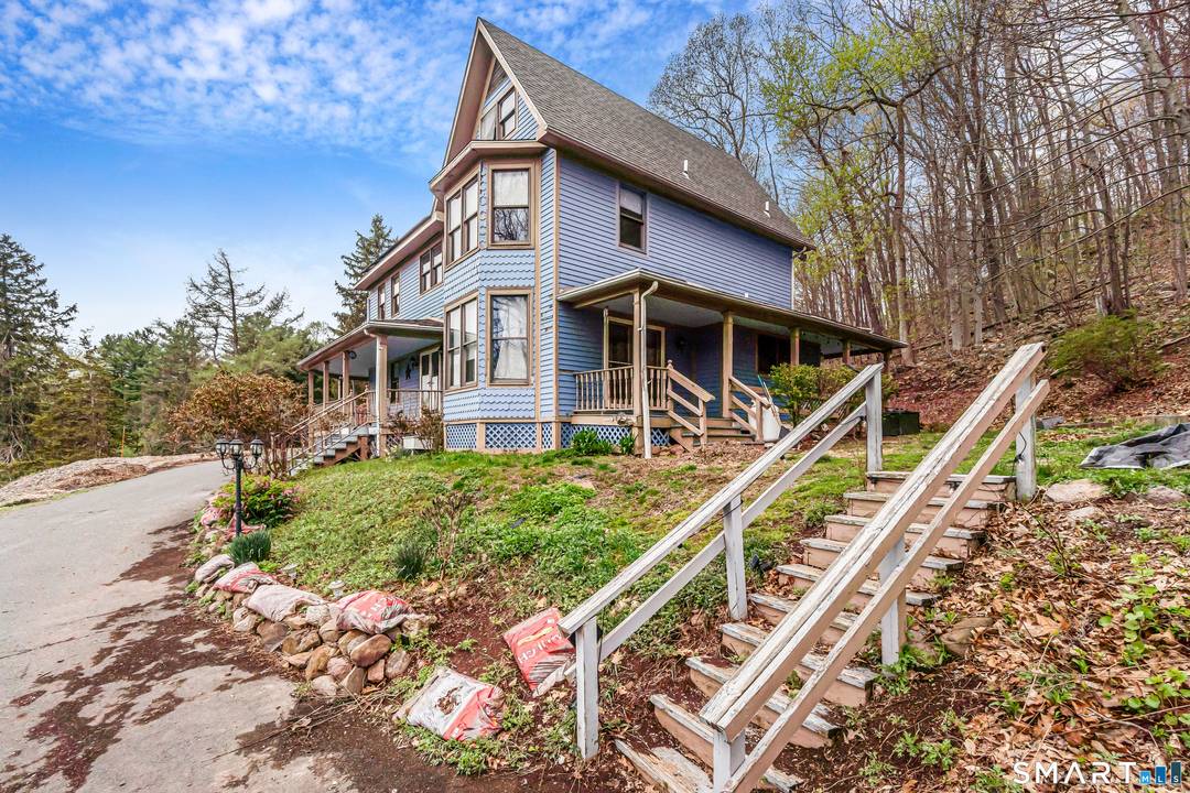 Tucked into the peaceful hills of Bethany, this enchanting Colonial feels like your own private retreat.