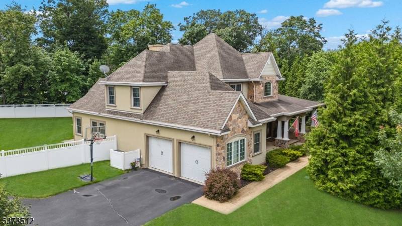 Introducing an impressive custom Colonial in the desirable Whippany area of Hanover Township, celebrated for its low taxes outstanding school system.