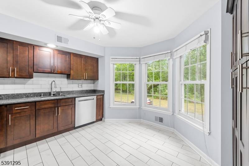 Welcome to 62 Brookstone Circle, a beautifully maintained and tastefully updated 2 bedroom, 1 full and 2 half bath townhouse in the desirable Brookstone community of Morris Plains Parsippany.