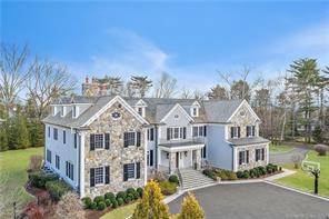 Majestic Georgian Colonial perfectly sited at the apex of an elevated 2 acre property situated within a private association in a prime Greenwich ''mid country'' location off Lake Avenue.