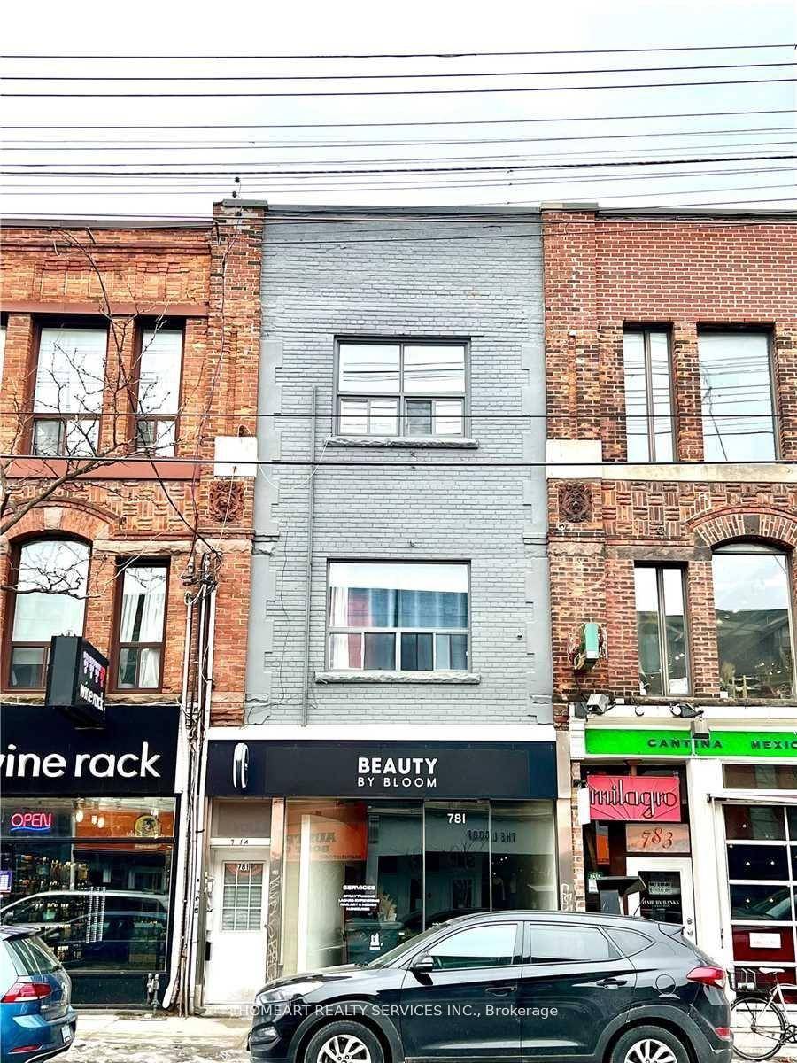 A Fully Tenanted Prime Queen West Retail Store With 4 Spacious Apartments Above With Rear Patio.