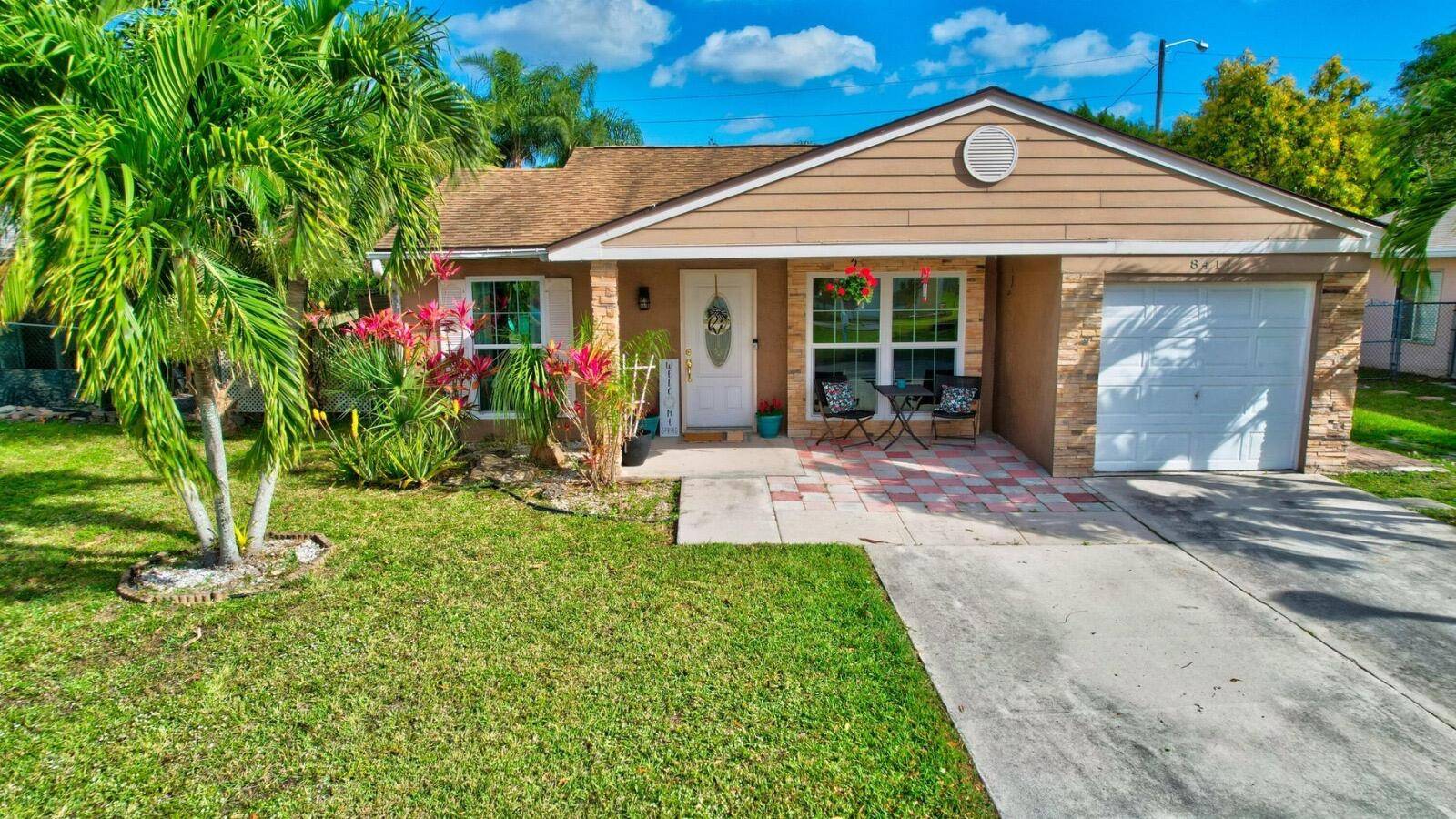 Welcome to this stunning 3 bedroom, 2 bathroom home featuring a private pool and lush tropical landscaping.