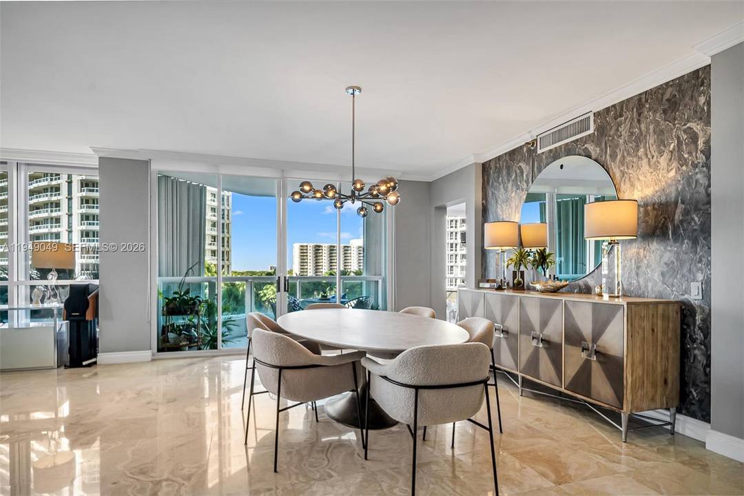 Welcome to this beautifully renovated 2 bedrooms plus den office, 2 and a half bathroom, corner unit with large balconies at The Point Atlantic II, Aventura, FL.