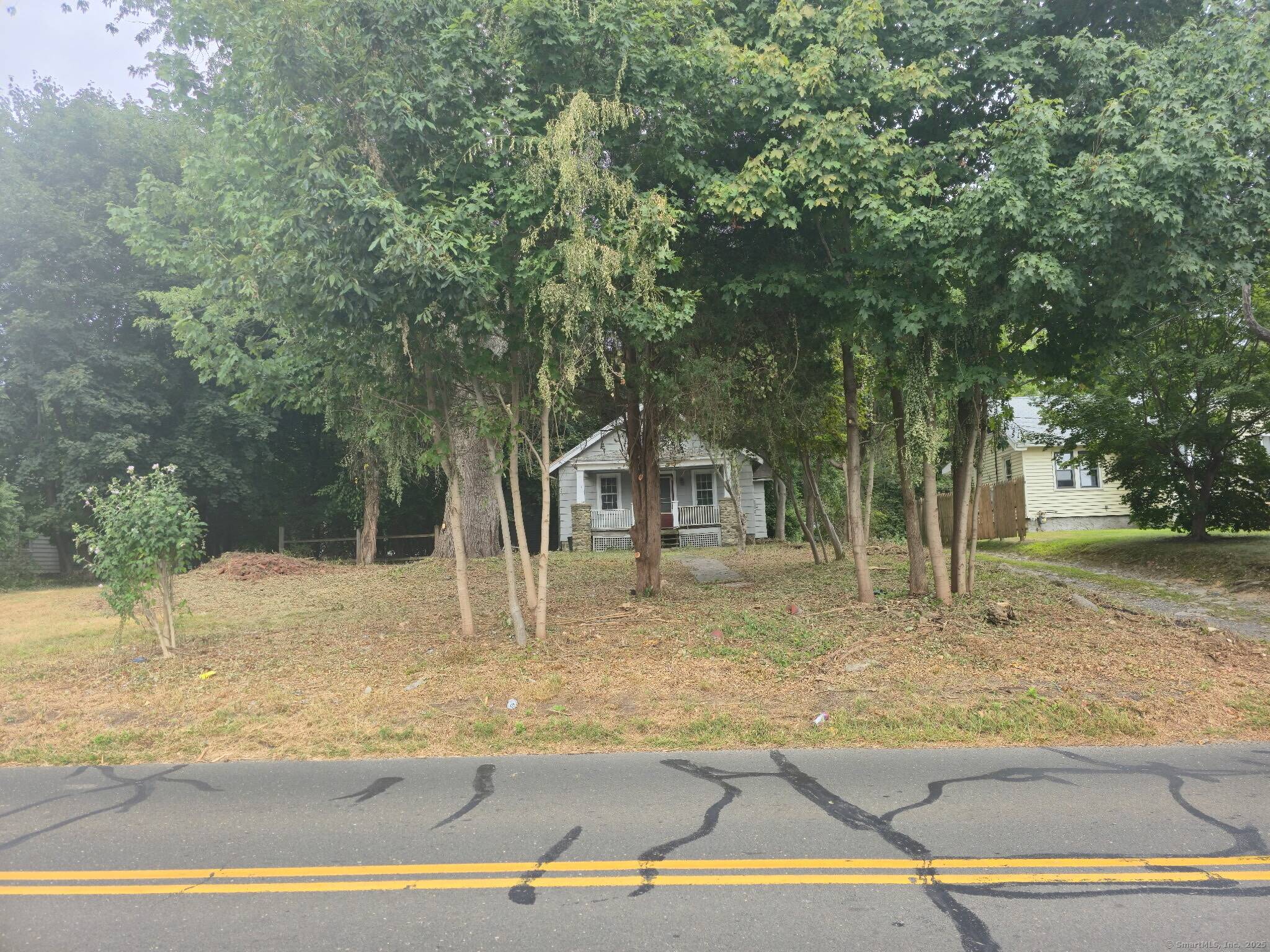 Double Lot Unbelievable opportunity to build your dream home or subdivide into two parcels possibilities are endless at 142 Wolfpit Avenue.