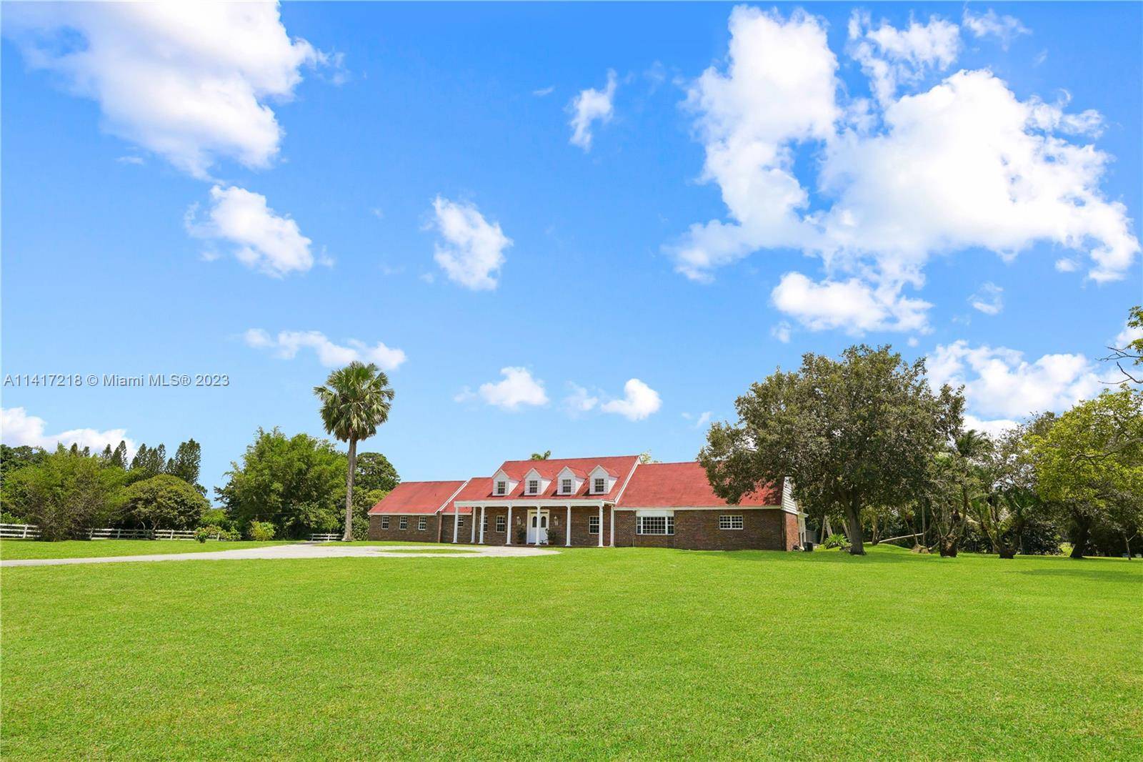 Discover this captivating home in the exclusive Rolling Oaks community in Southwest Ranches.