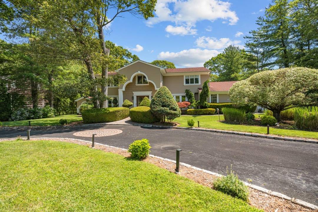 Welcome to 10 Faulkner Lane, a beautifully appointed estate offering space, style, and comfort on a full acre in one of Dix Hills most desirable neighborhoods.