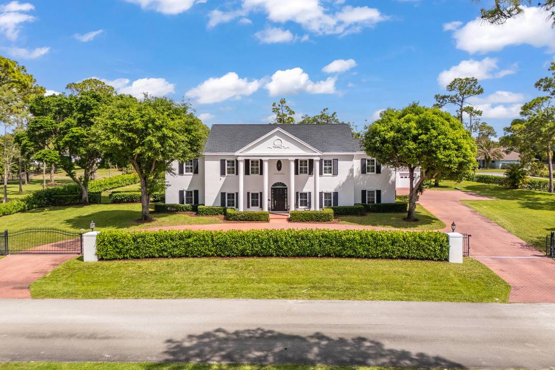 Experience the epitome of luxury in this meticulously maintained two story colonial architecture style estate with its graceful symmetry, stately elegance and modern flair nestled on 1.