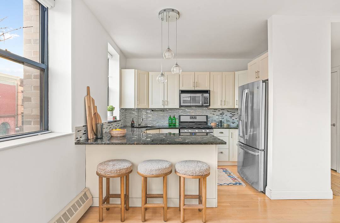 This bright and airy two bedroom, two bathroom condo is perched in a beautifully converted industrial building, offering soaring 9 foot ceilings, oversized windows, and your own private rooftop terrace ...